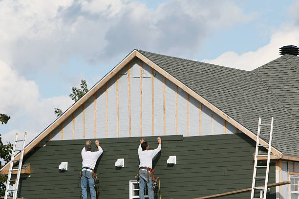Professional Storm Damage Siding Repair technician working in Spangler, PA